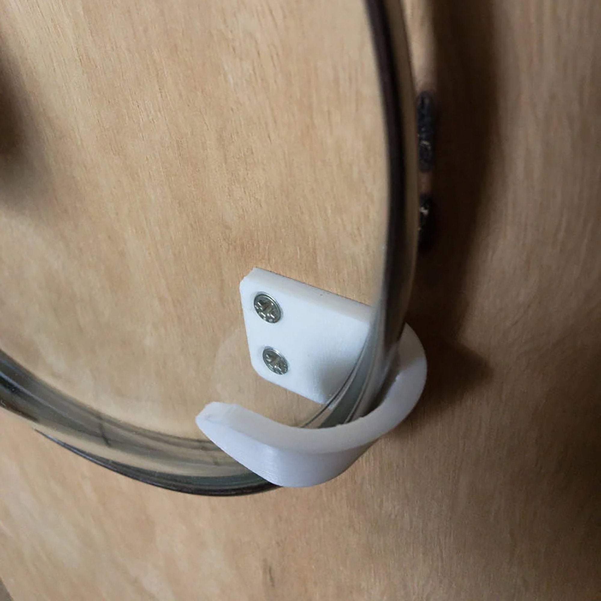 a close up of a door handle on a wooden door