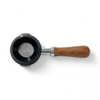 Dosing funnel sitting on a 58mm espresso portafilter basket rim, view 2