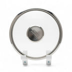Wall mounted pot lid holder on a cabinet side holding a glass lid upright