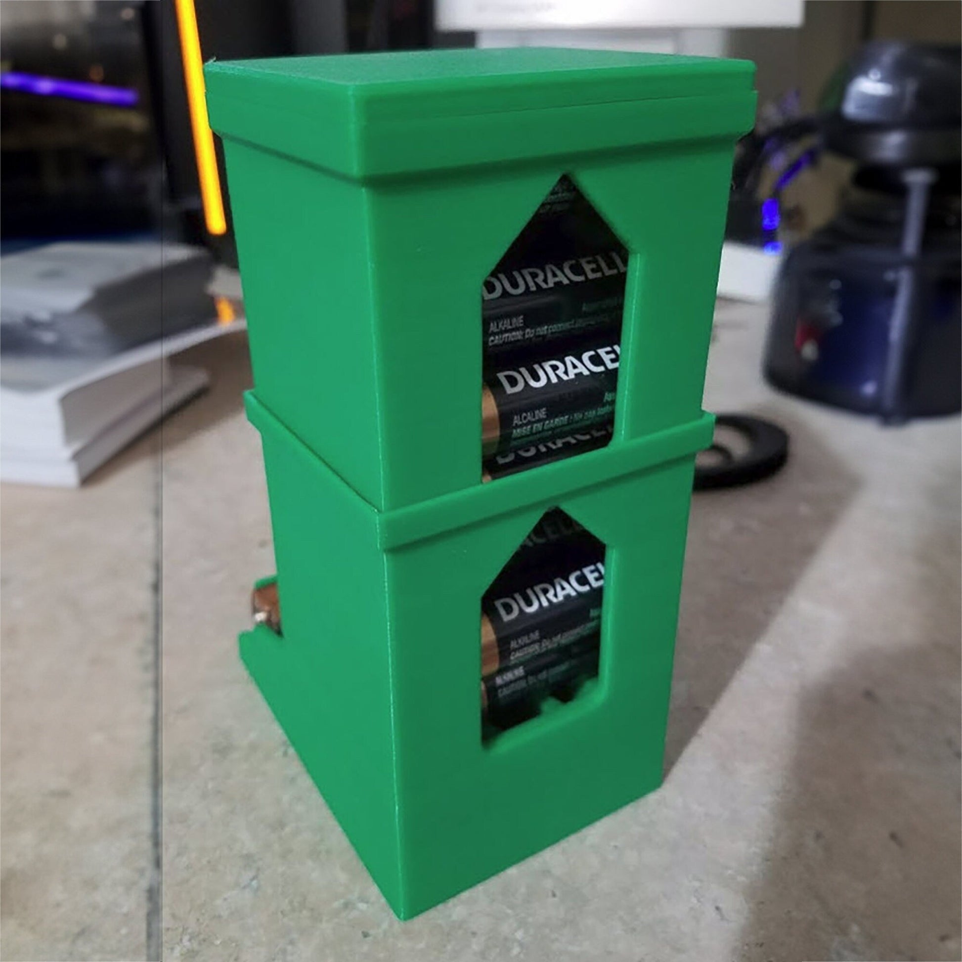 a couple of green boxes sitting on top of a counter