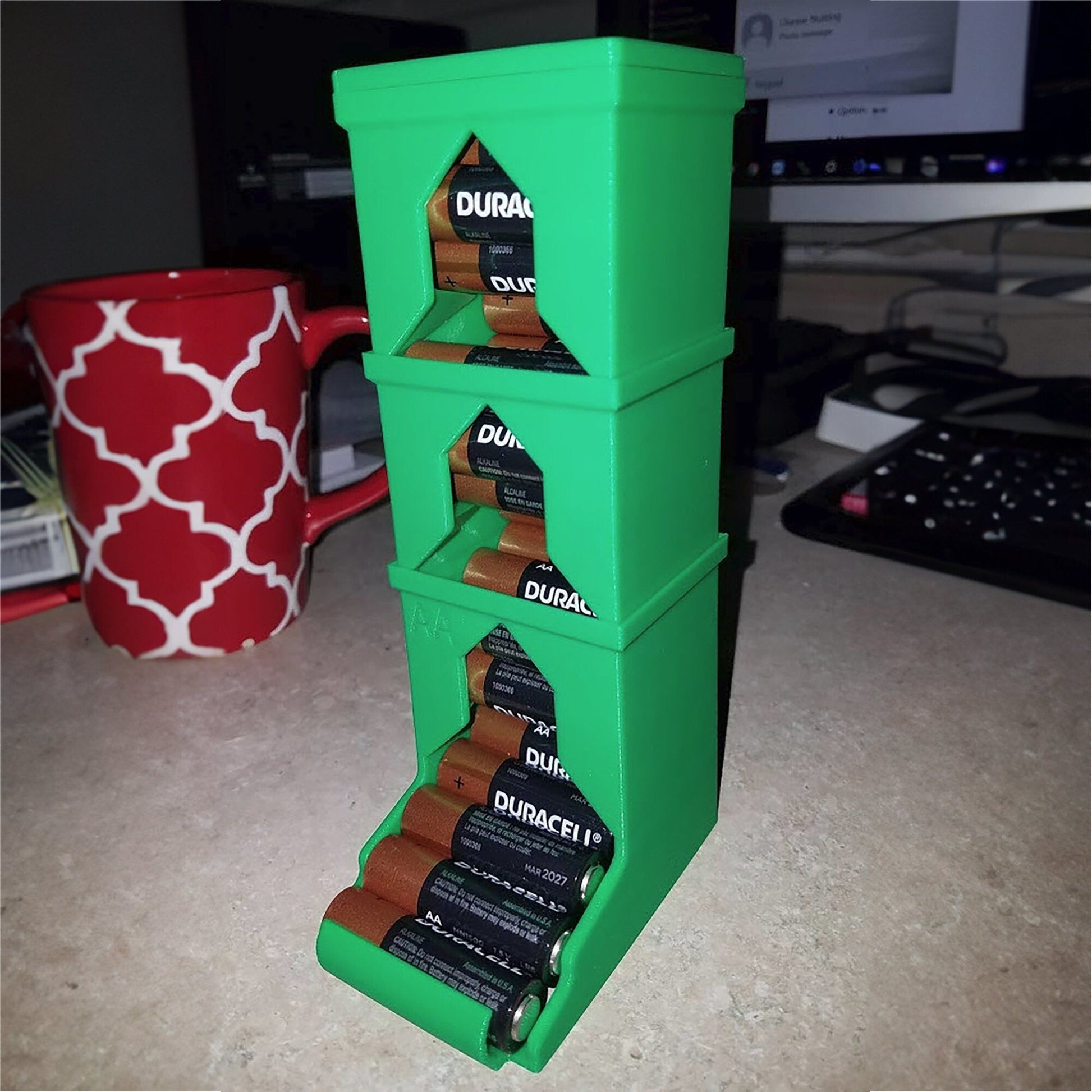 a stack of three boxes sitting on top of a counter