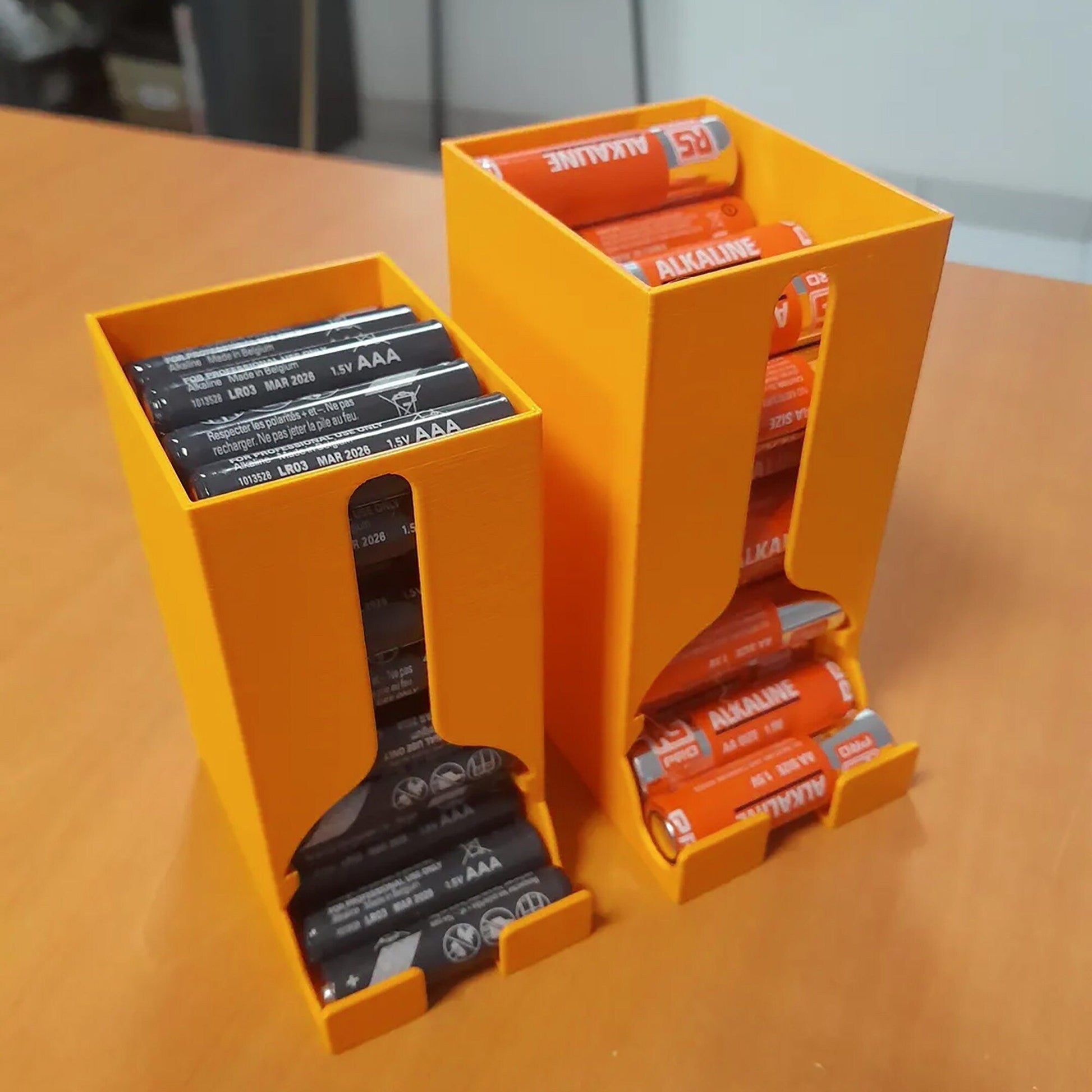 a couple of orange boxes sitting on top of a wooden table