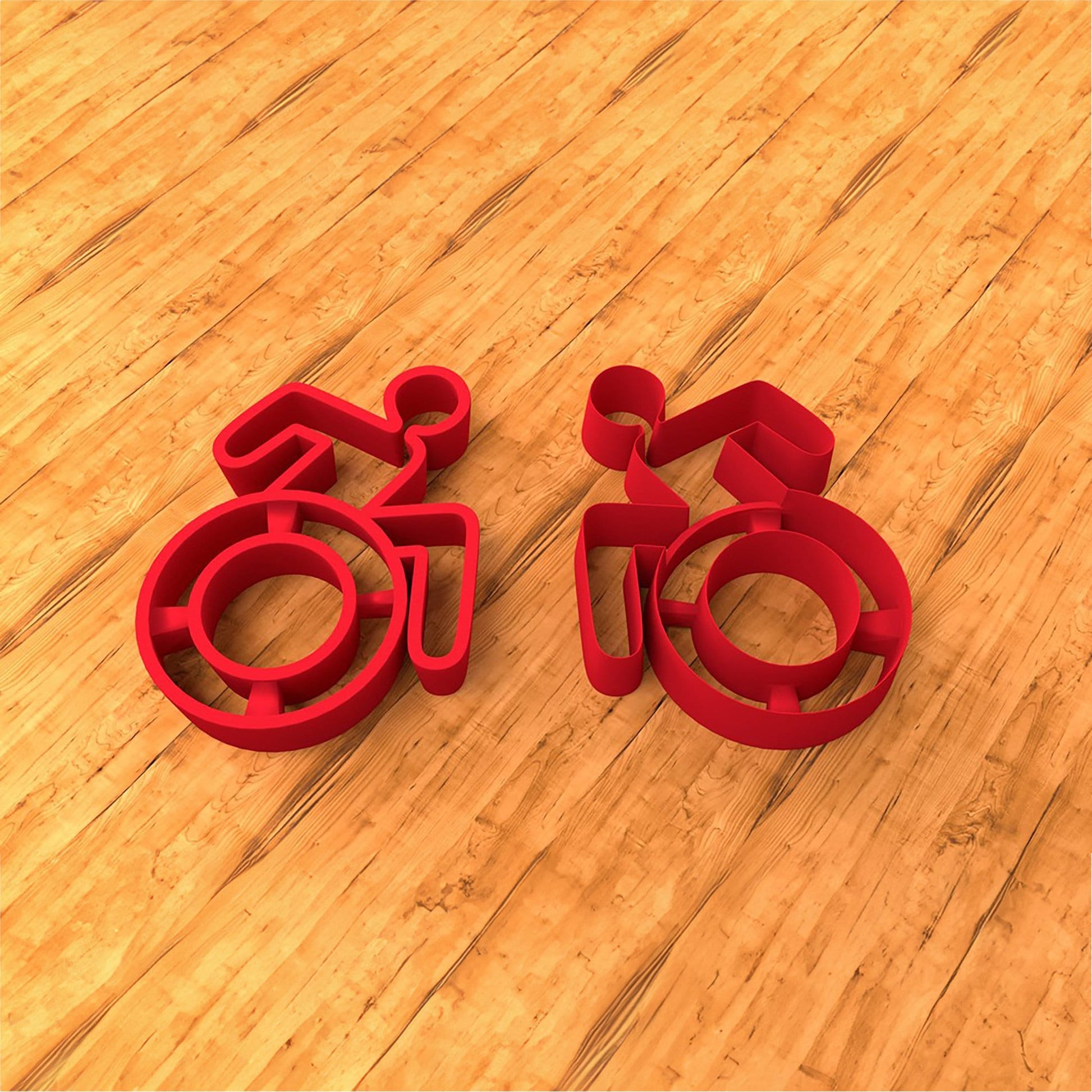 a couple of red objects sitting on top of a wooden floor