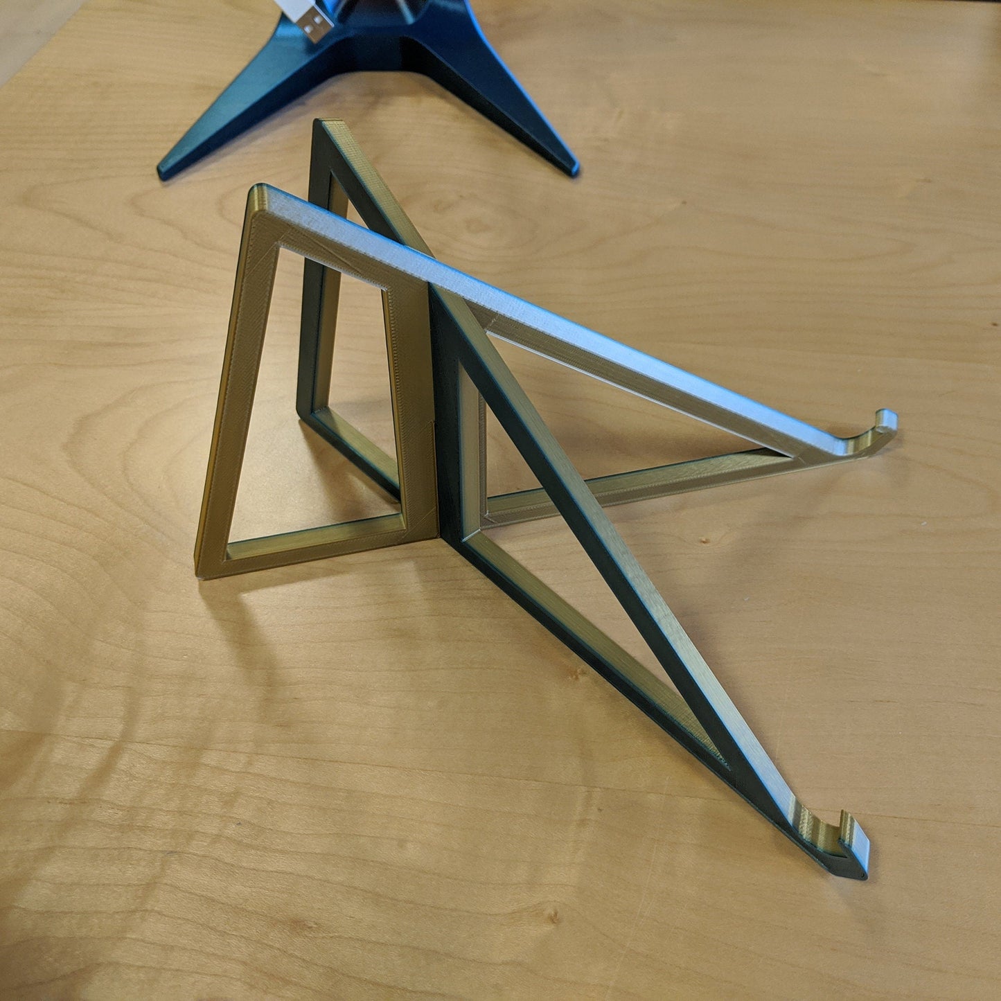 a wooden table with a metal object on top of it