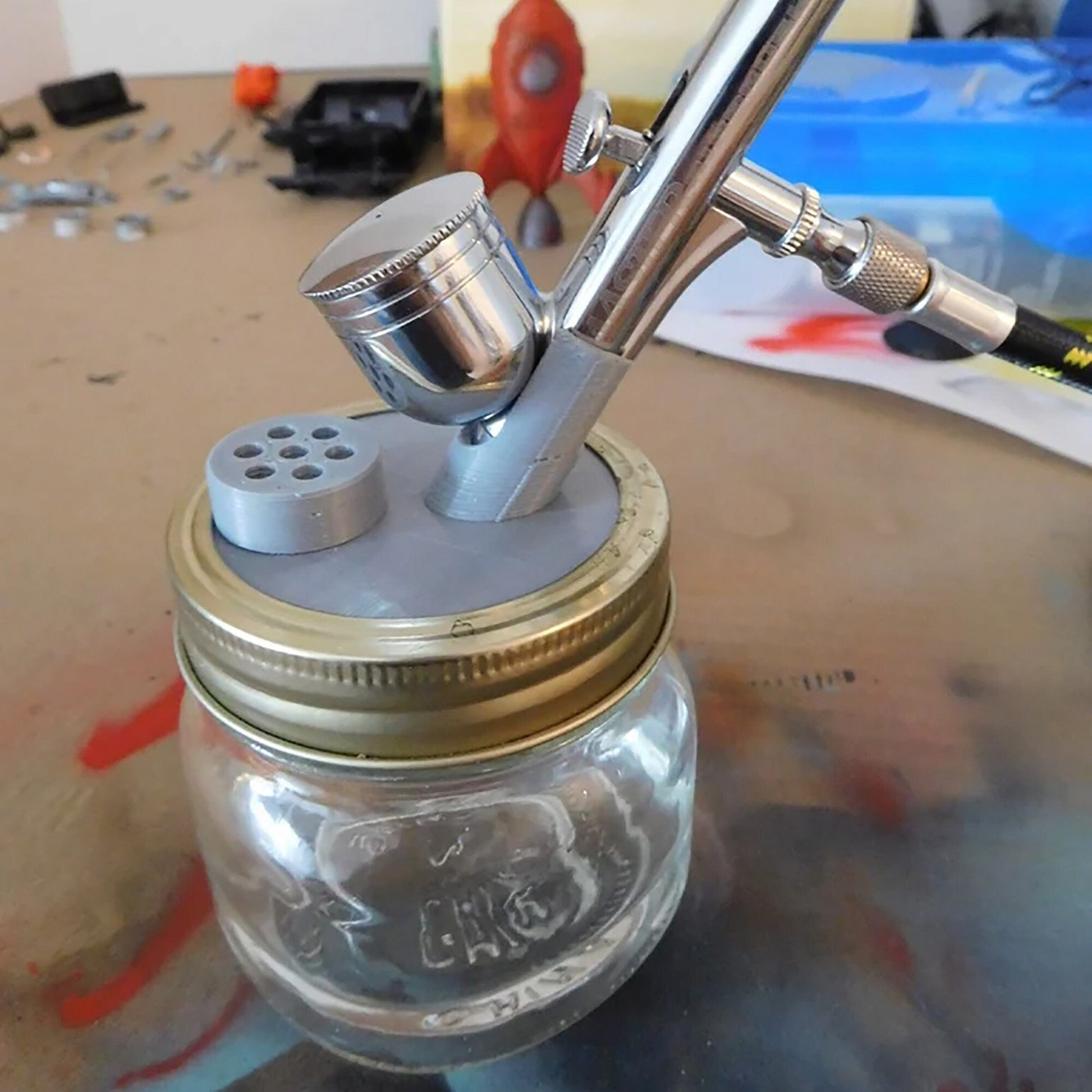 a glass jar with a fishing rod in it