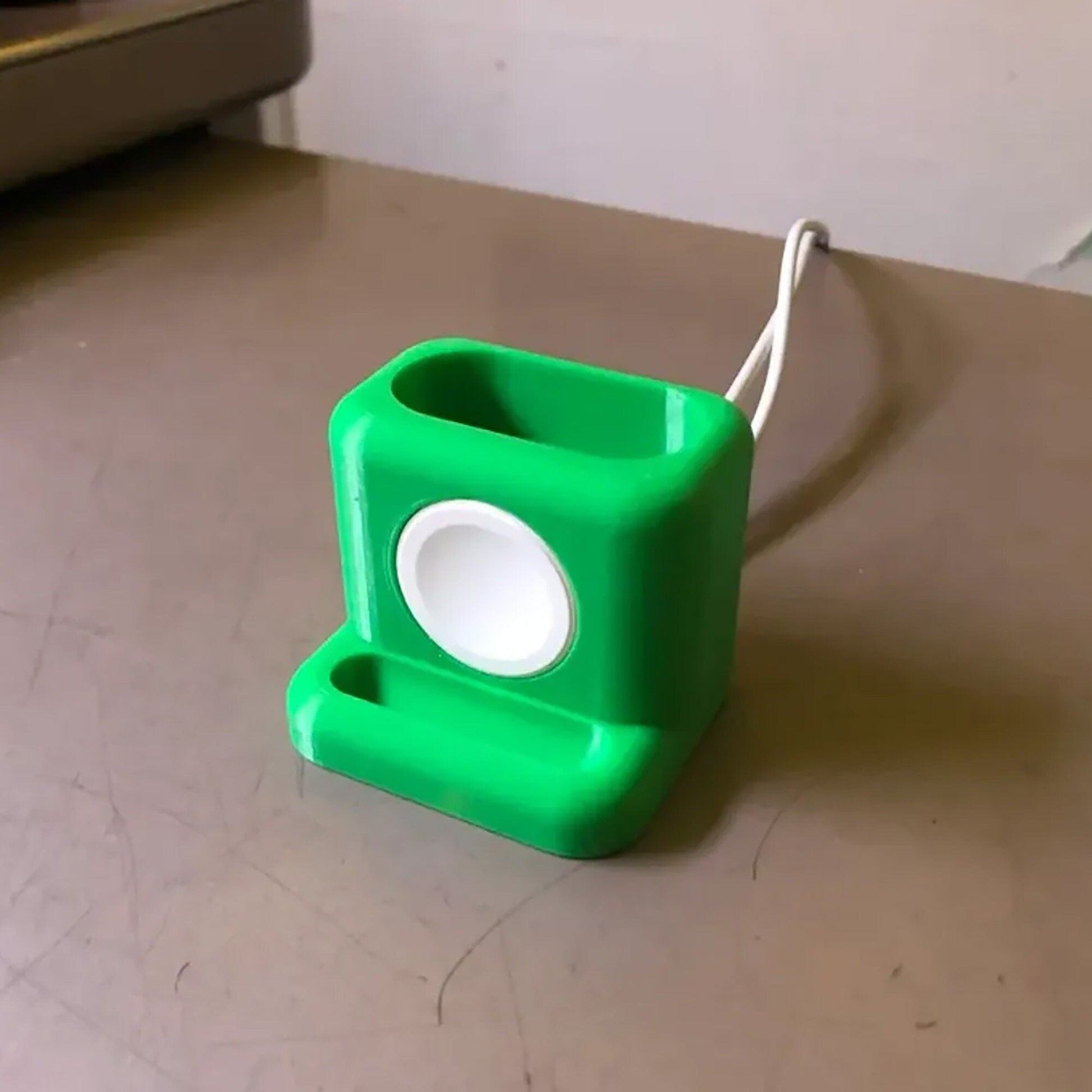 a green object sitting on top of a table