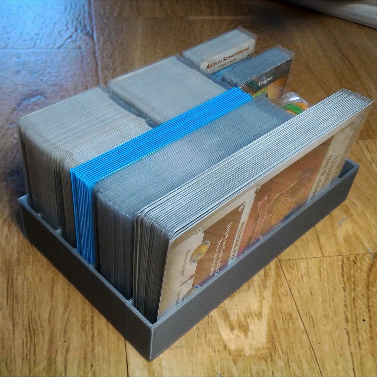 a stack of money sitting on top of a wooden floor