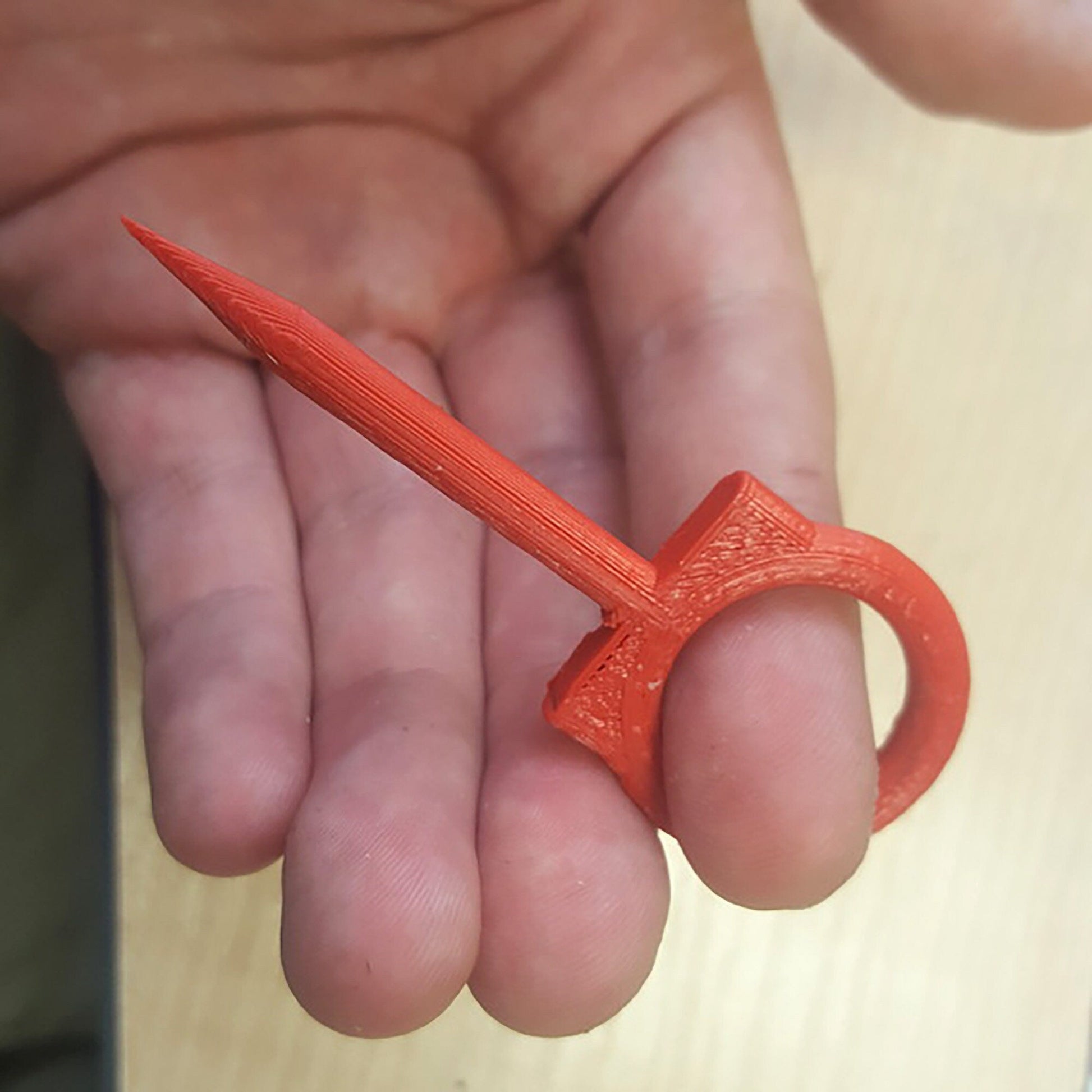 a person holding a pair of scissors in their hand