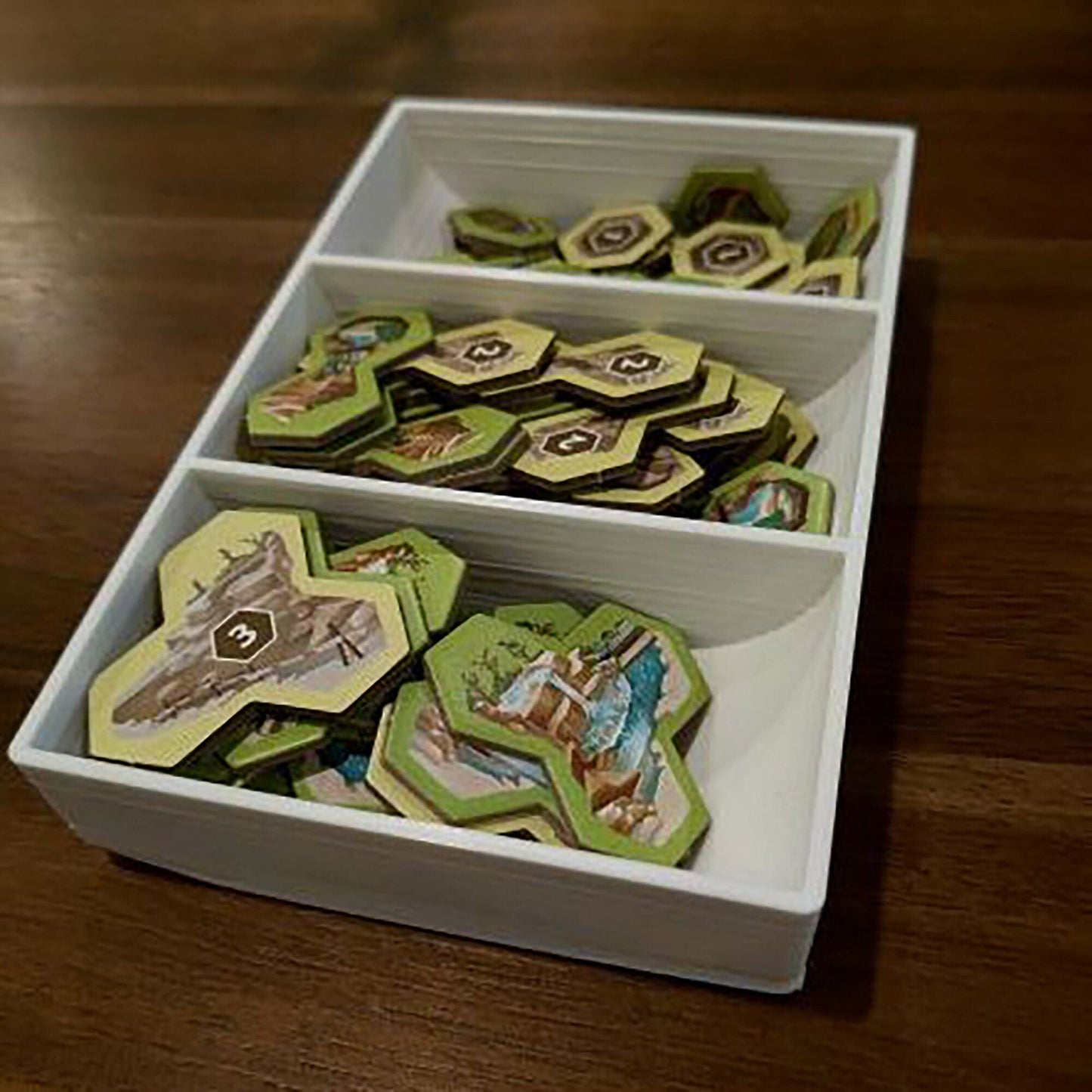 a white box filled with green and yellow cookies