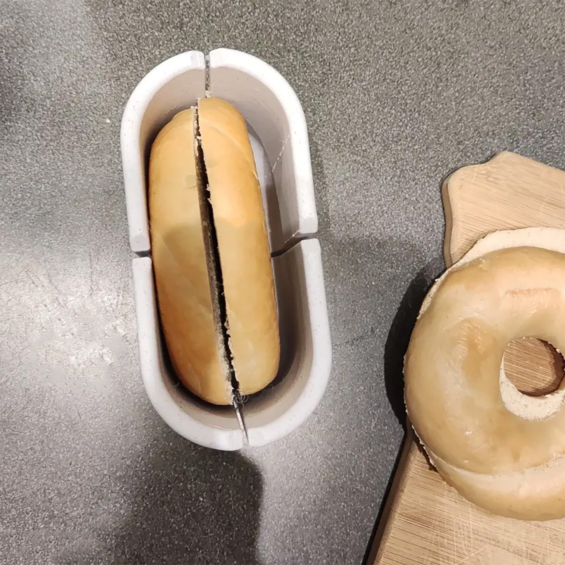 a couple of doughnuts sitting on top of a cutting board