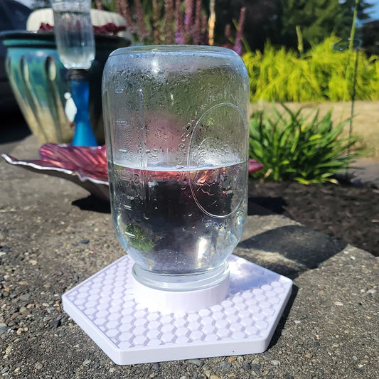 a glass of water sitting on top of a scale