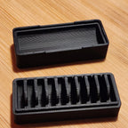 CR1632 coin cell storage box with a slotted tray and lift-off lid, view 3