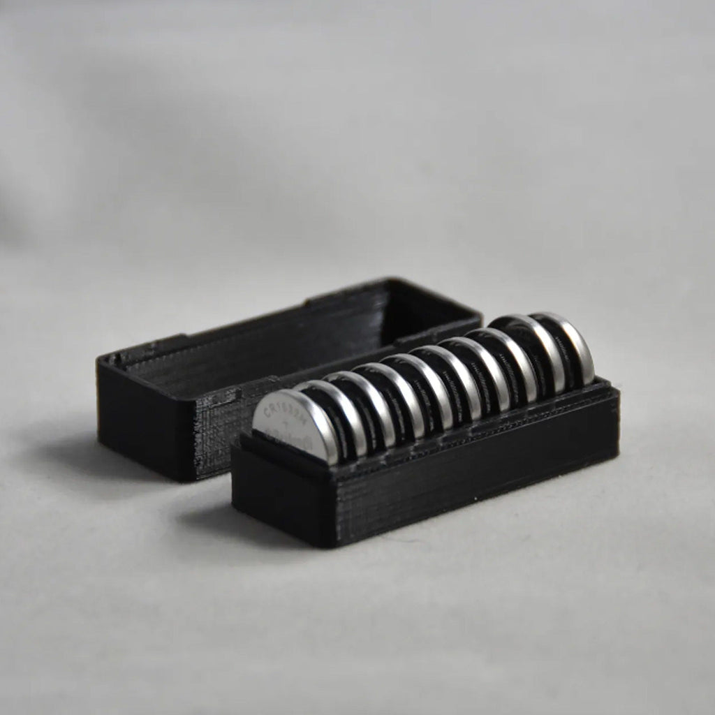 CR1632 coin cell storage box with a slotted tray and lift-off lid