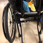 Cane holder clip attaching a walking cane to a walker or wheelchair frame, view 2
