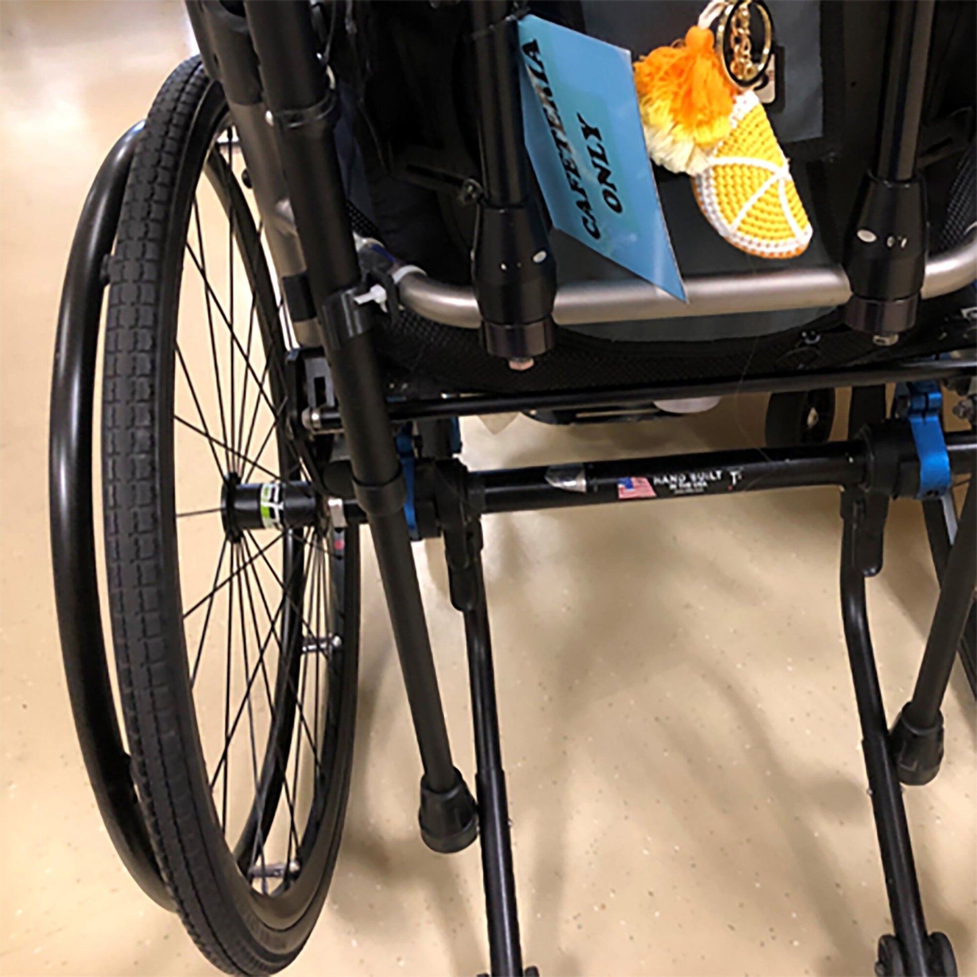 a wheelchair with a book and a pair of shoes on it