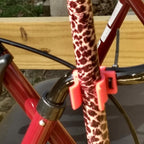 Cane holder clip attaching a walking cane to a walker or wheelchair frame, view 3