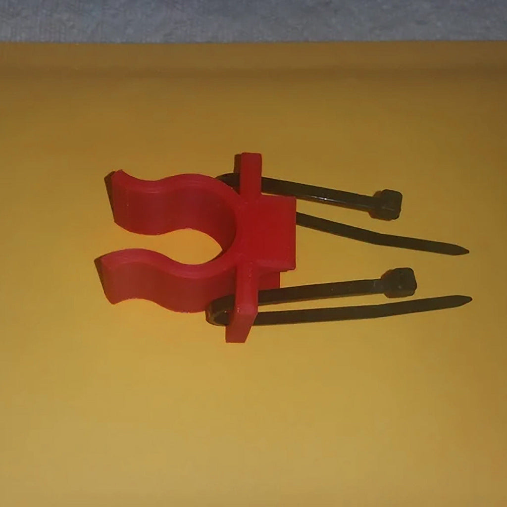 Cane holder clip attaching a walking cane to a walker or wheelchair frame, view 4