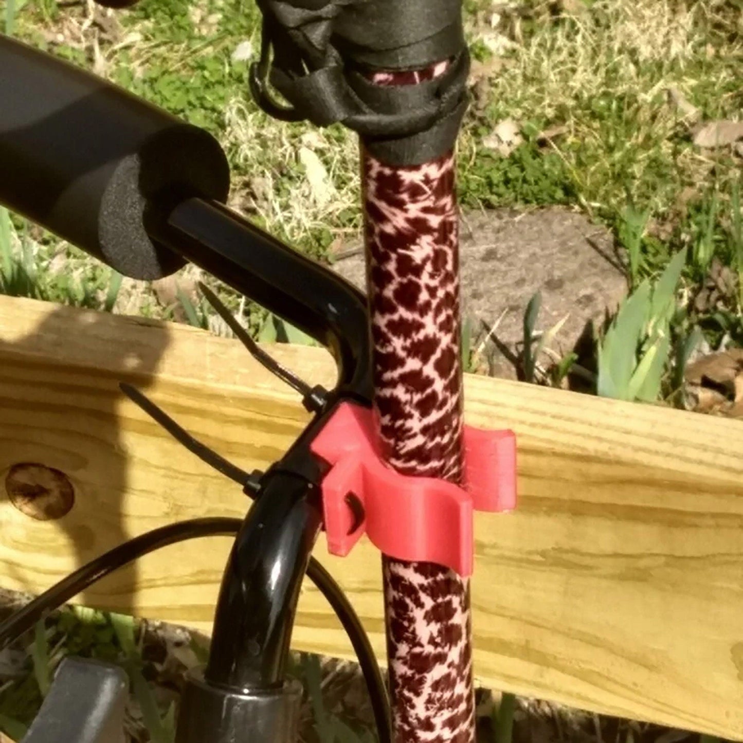 a close up of a bicycle handlebar with a giraffe print