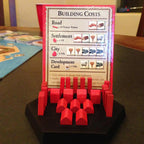 Player piece holder for Catan with slots for settlements, cities, roads and the cost card