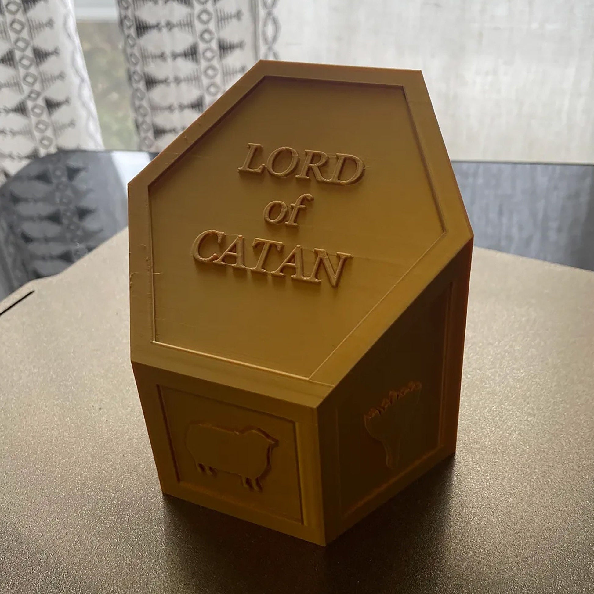 a brown box with the words lord of catan on it