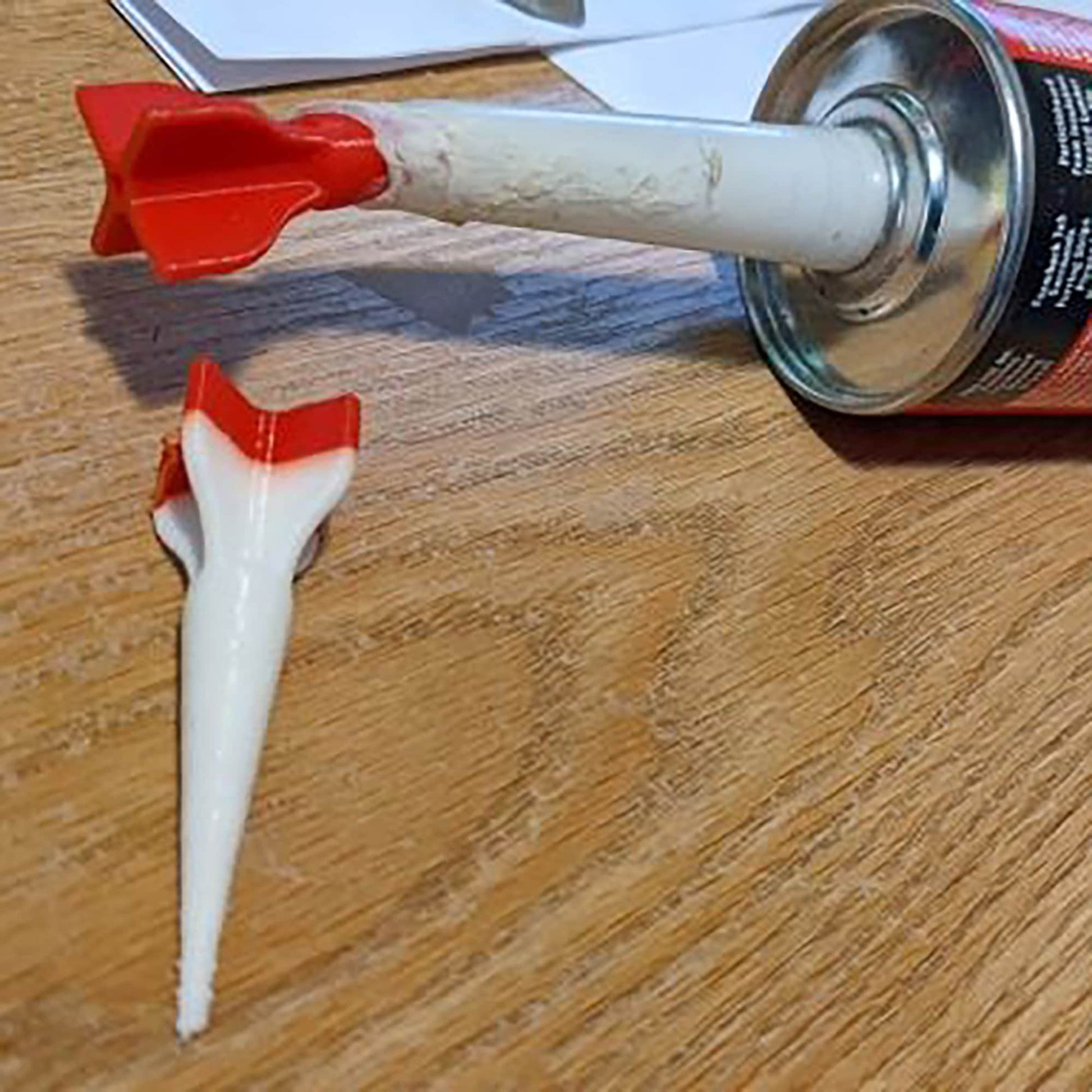 a can of toothpaste and a toothbrush on a table