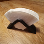 Saddle-shaped coffee filter holder with a stack of No.4 cone paper filters, view 2