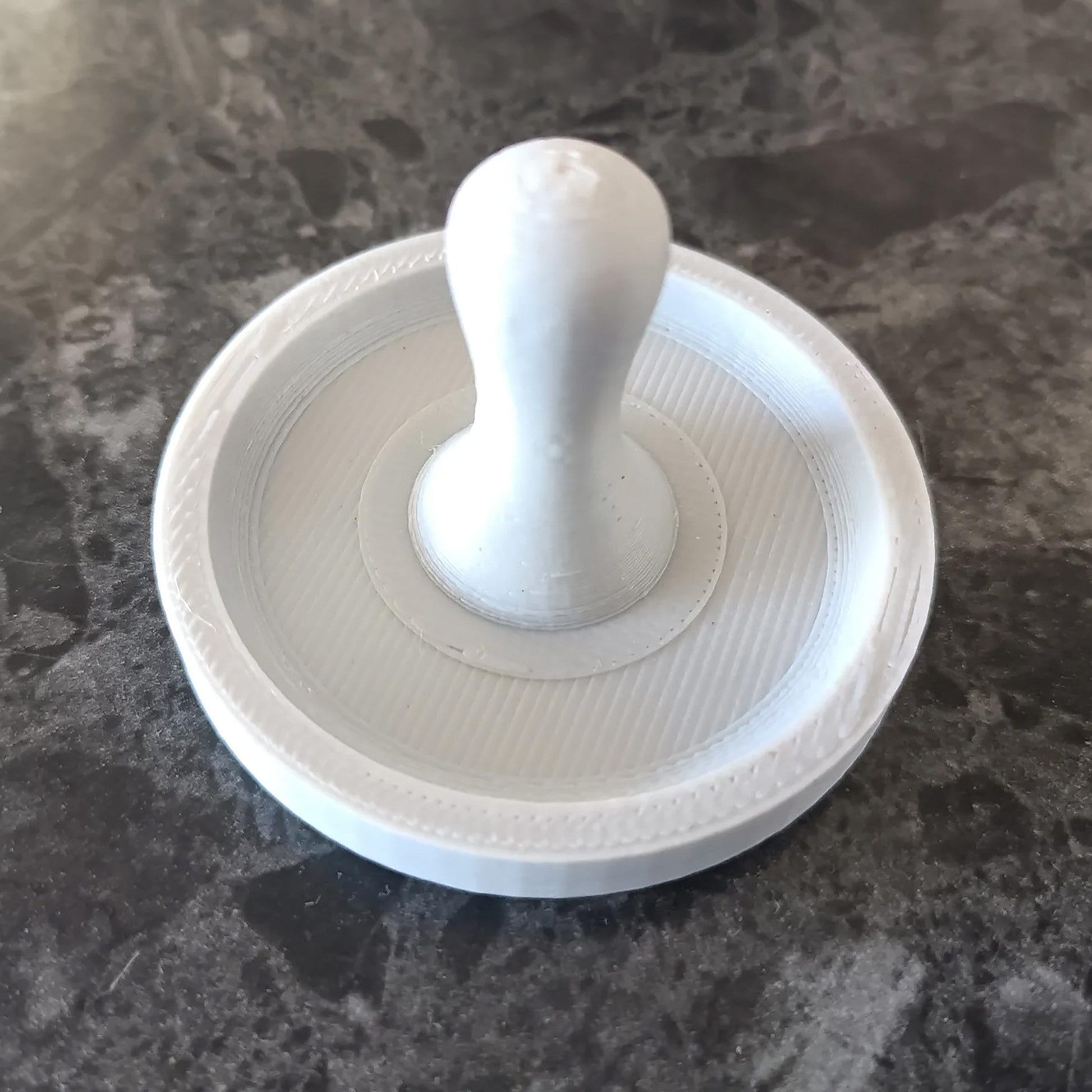 a white object sitting on top of a table