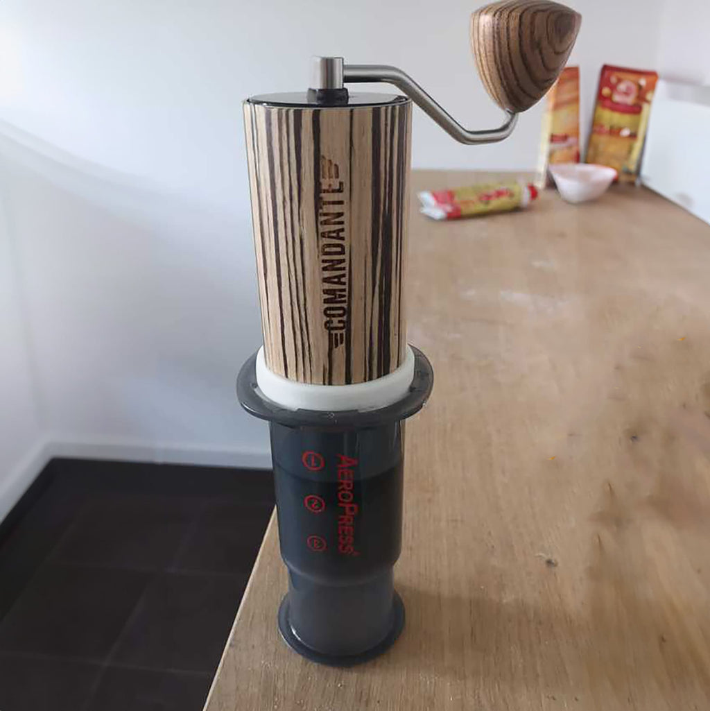 Grind catch adapter connecting a Comandante C40 hand grinder to an AeroPress, view 2