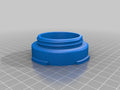 a blue plastic object sitting on top of a tiled floor