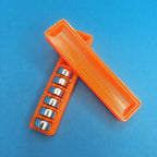 Button cell storage box with slotted insert holding LR44 batteries, view 3