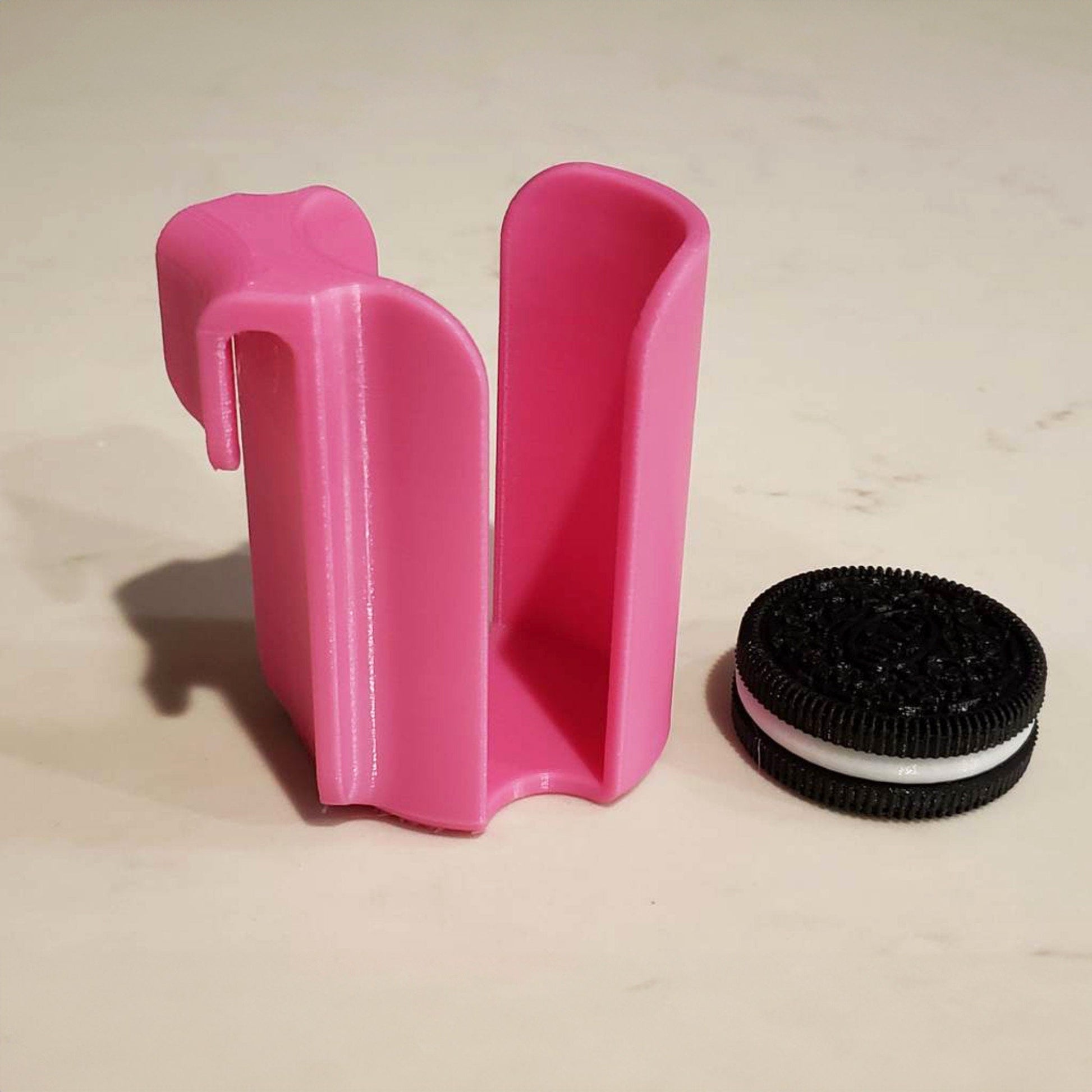 a cookie and a pink toothbrush holder