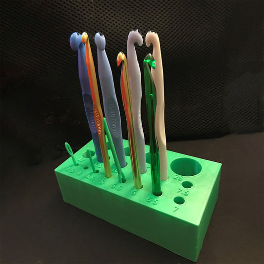 a group of toothbrushes sitting on top of a green holder