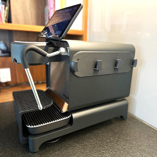 a laptop is sitting on top of a machine