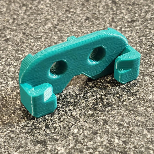 a blue plastic object sitting on top of a cement floor