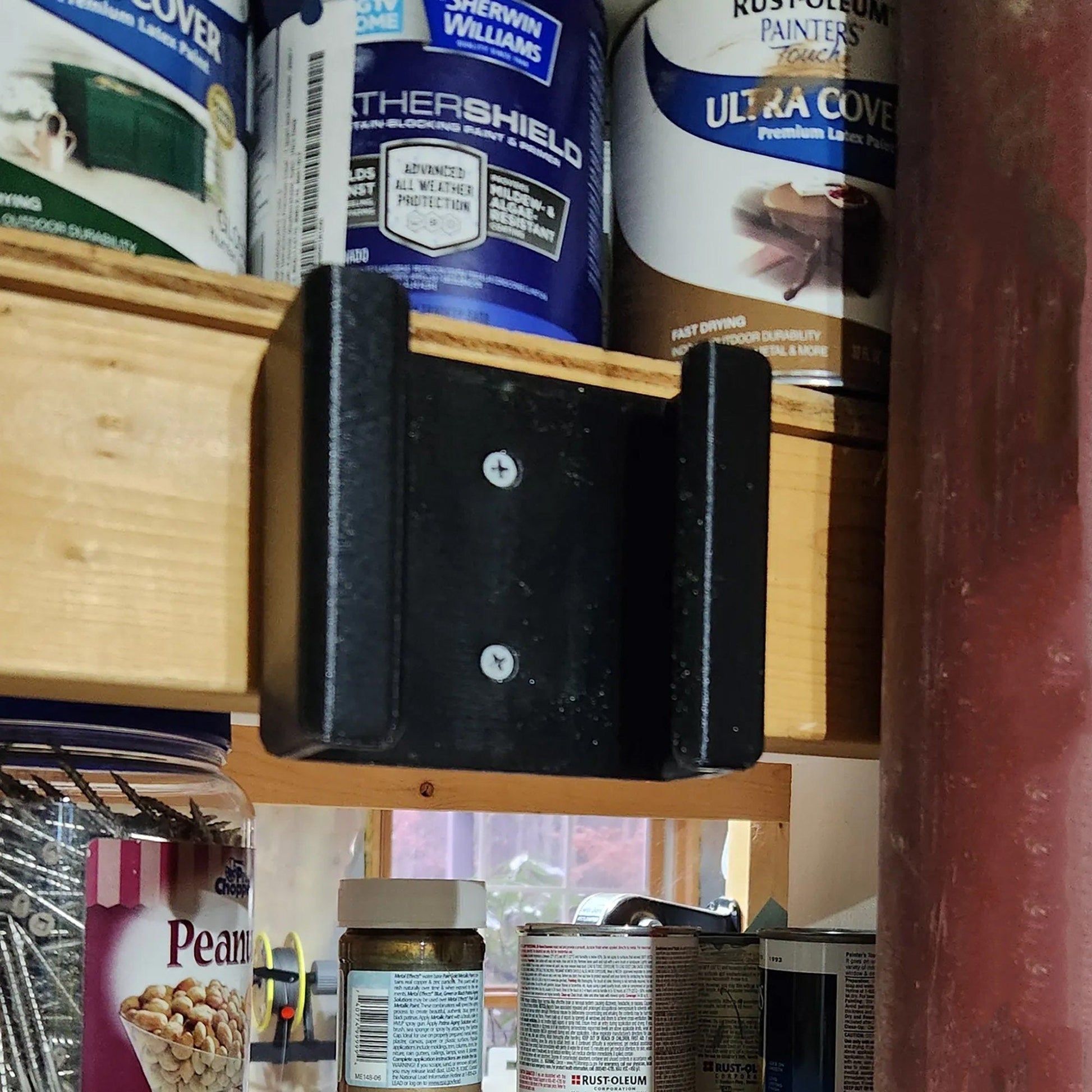 a close up of a shelf with a can of food on it