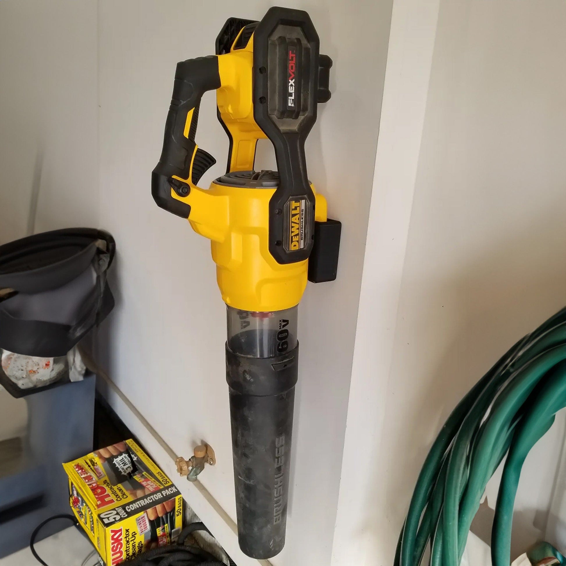 a cordless drill is attached to a wall