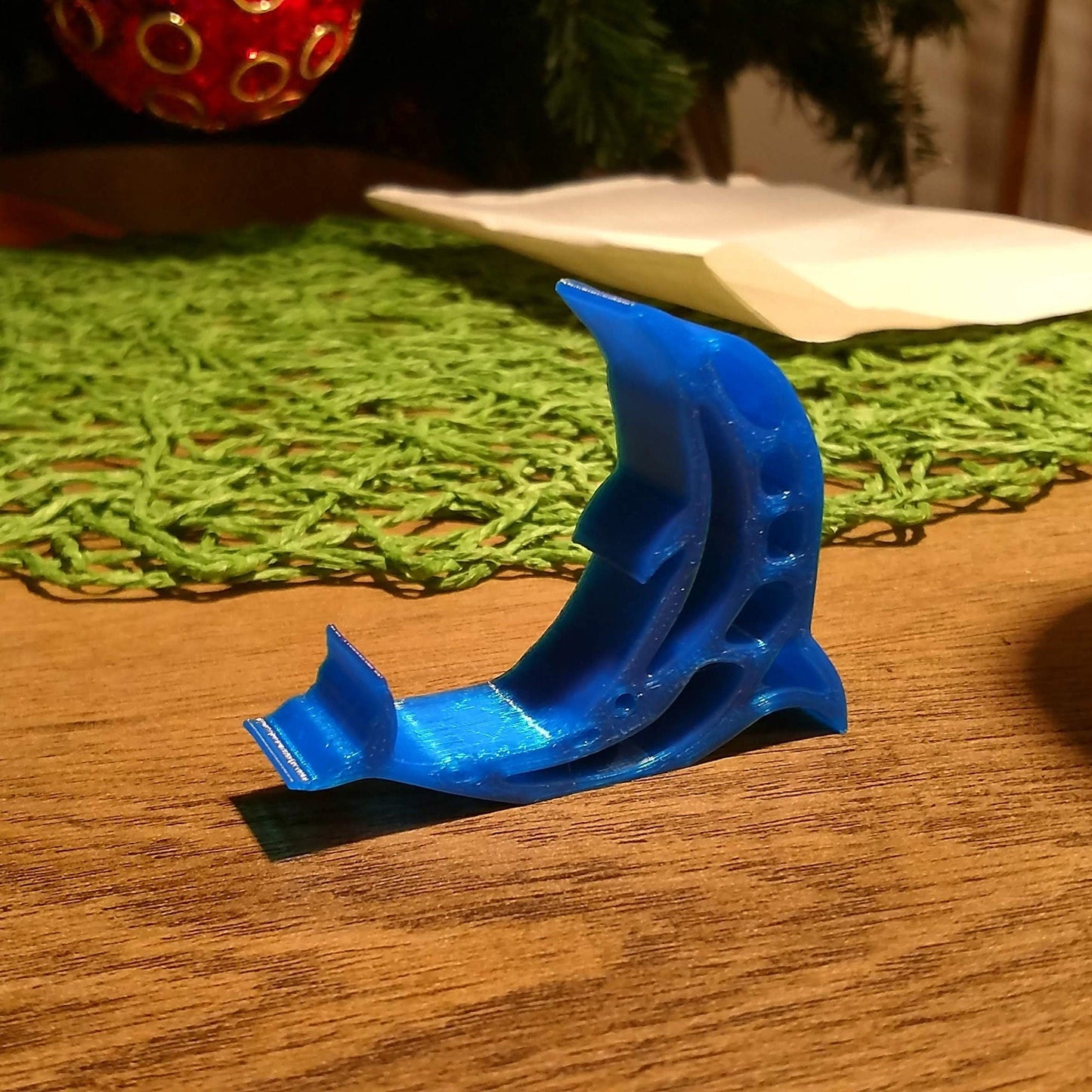 a blue object sitting on top of a wooden table