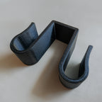 Sponge holder over a double kitchen sink divider holding two sponges, view 4