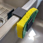 Sponge holder over a double kitchen sink divider holding two sponges
