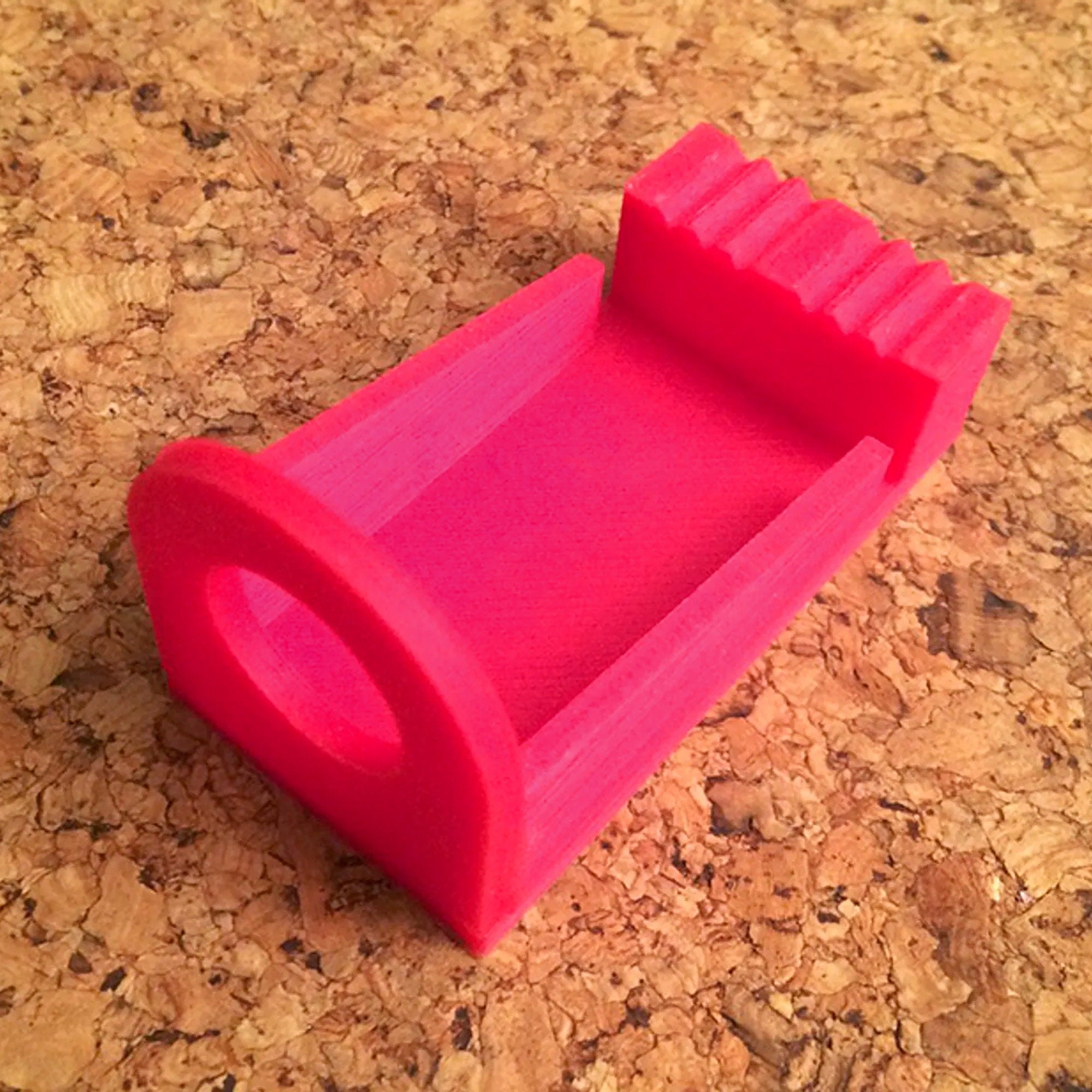 a pink object sitting on top of a table