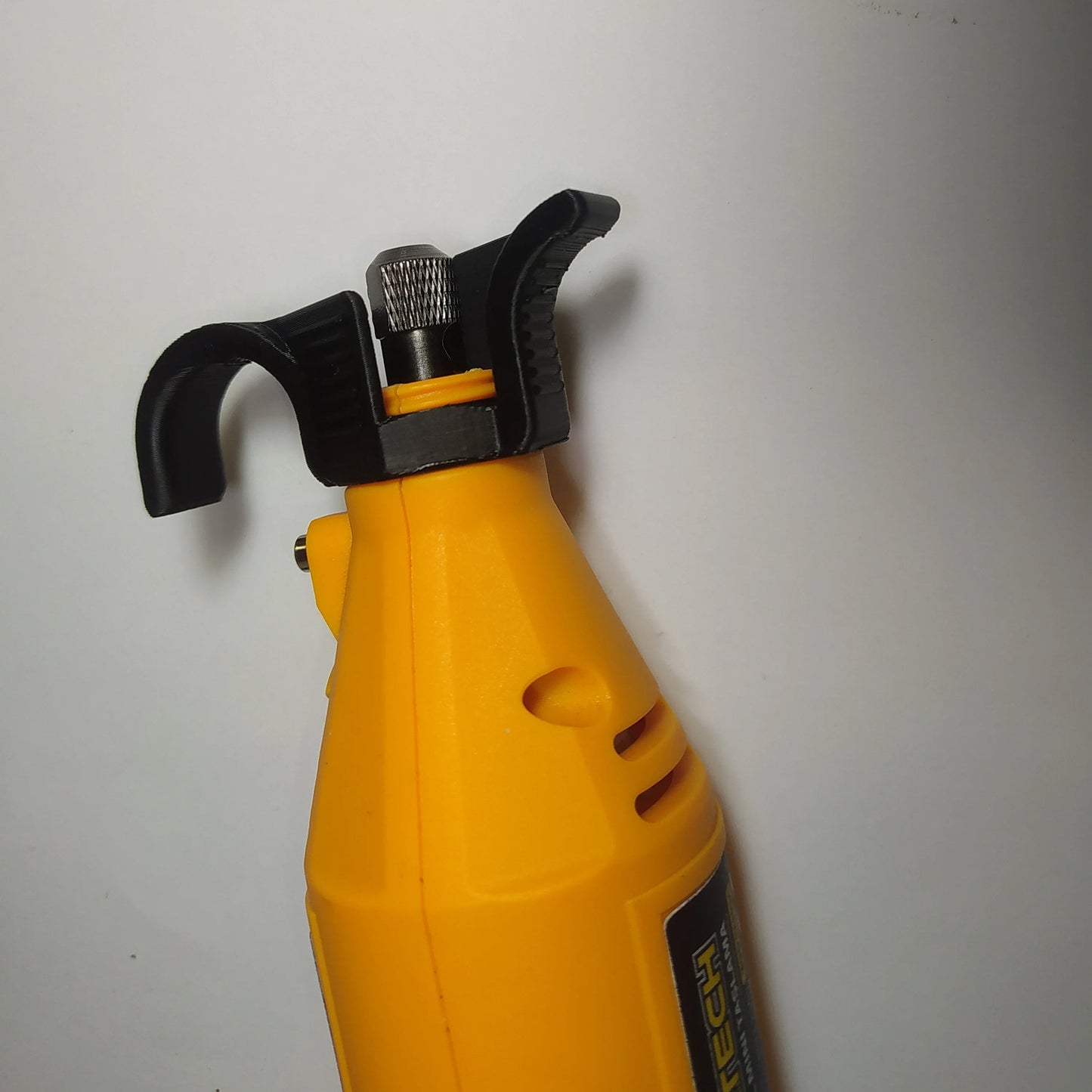 a yellow spray bottle with a black handle