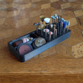 a wooden table topped with lots of pins and needles