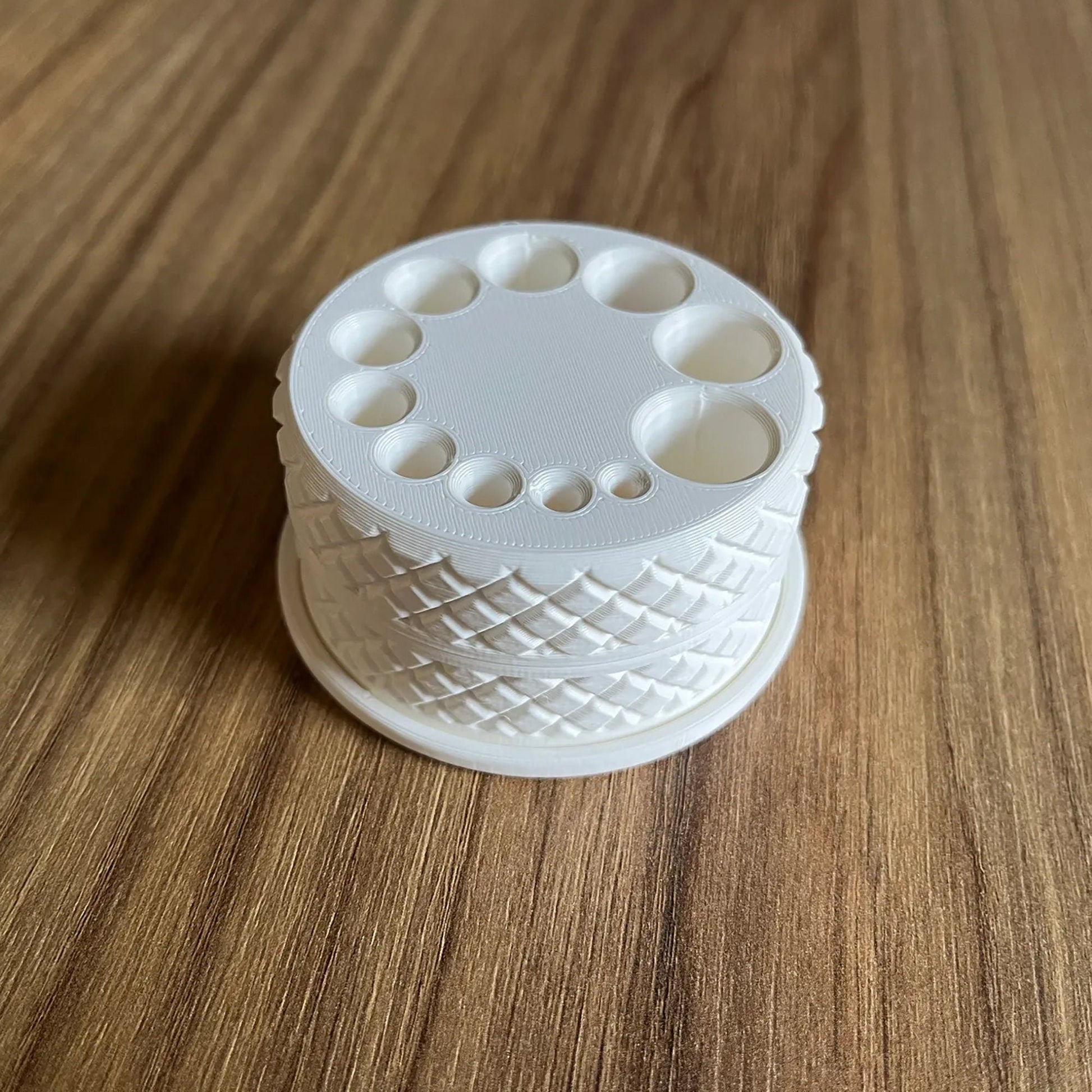 a white object sitting on top of a wooden table