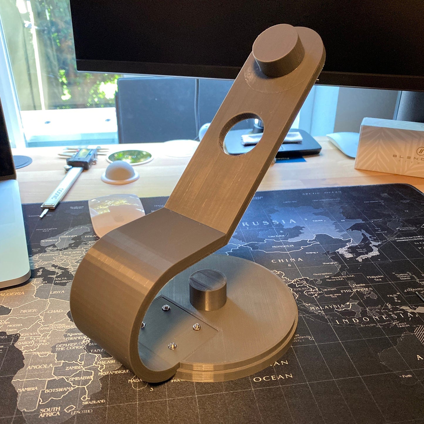 a metal object sitting on top of a desk