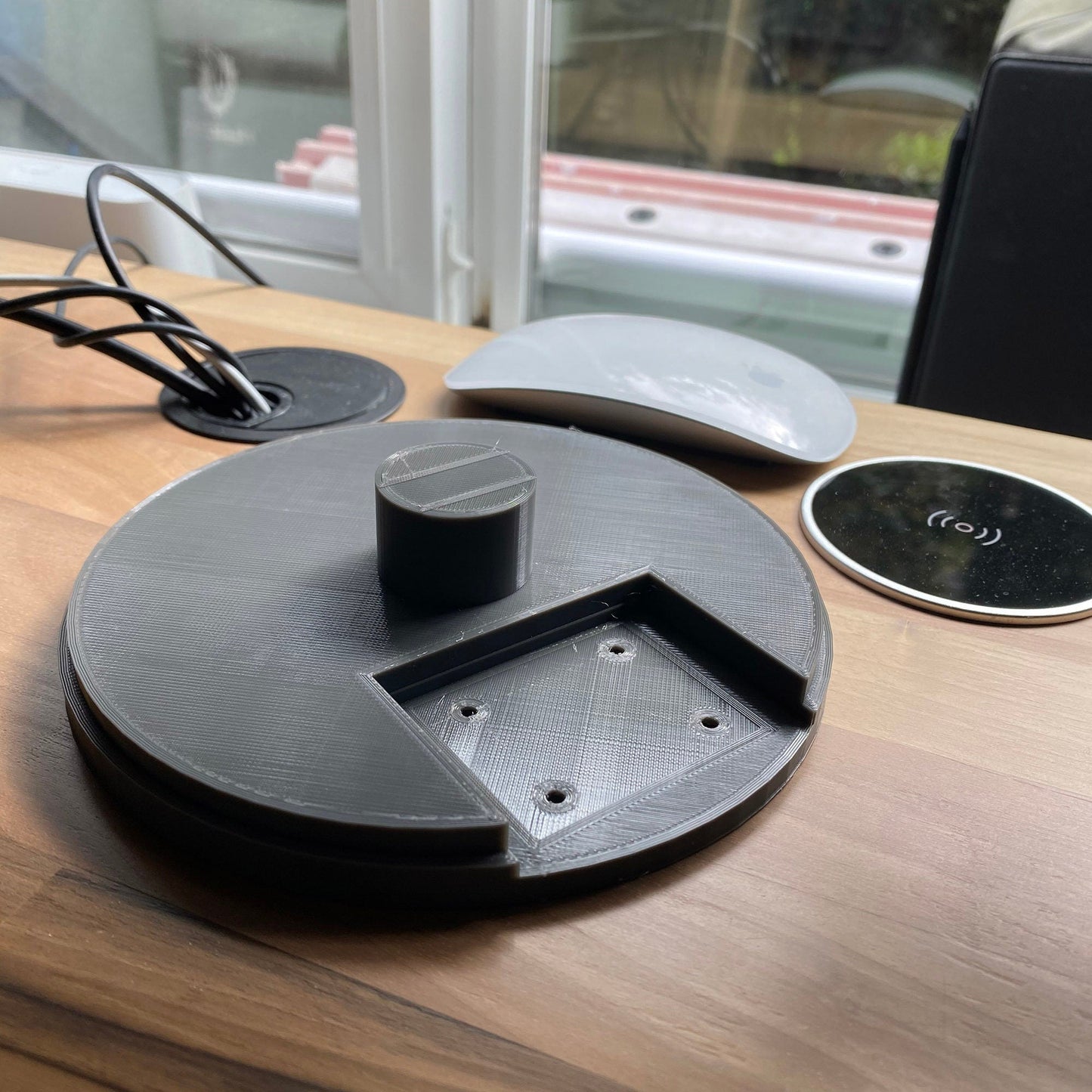 a wooden table topped with a laptop computer