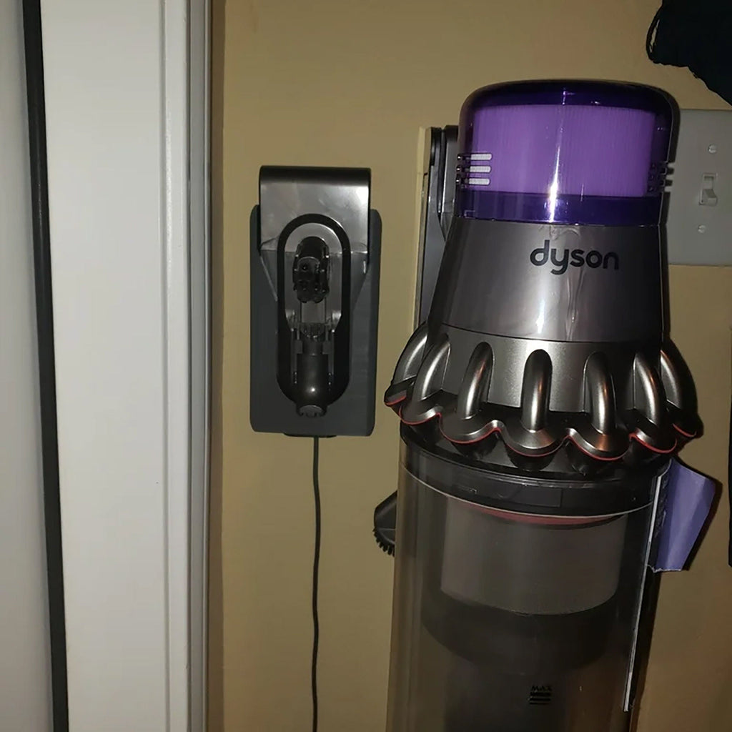 Wall mount charging dock holding a spare Dyson V8 to V15 battery and handle, view 4
