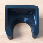 Wall mount wand holder storing a Dyson stick vacuum extension tube upright, view 4