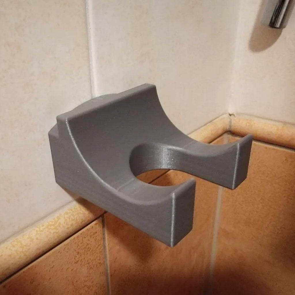 Bathroom wall mount holder for Dyson Supersonic hair dryer with cord routed down the wall, view 2