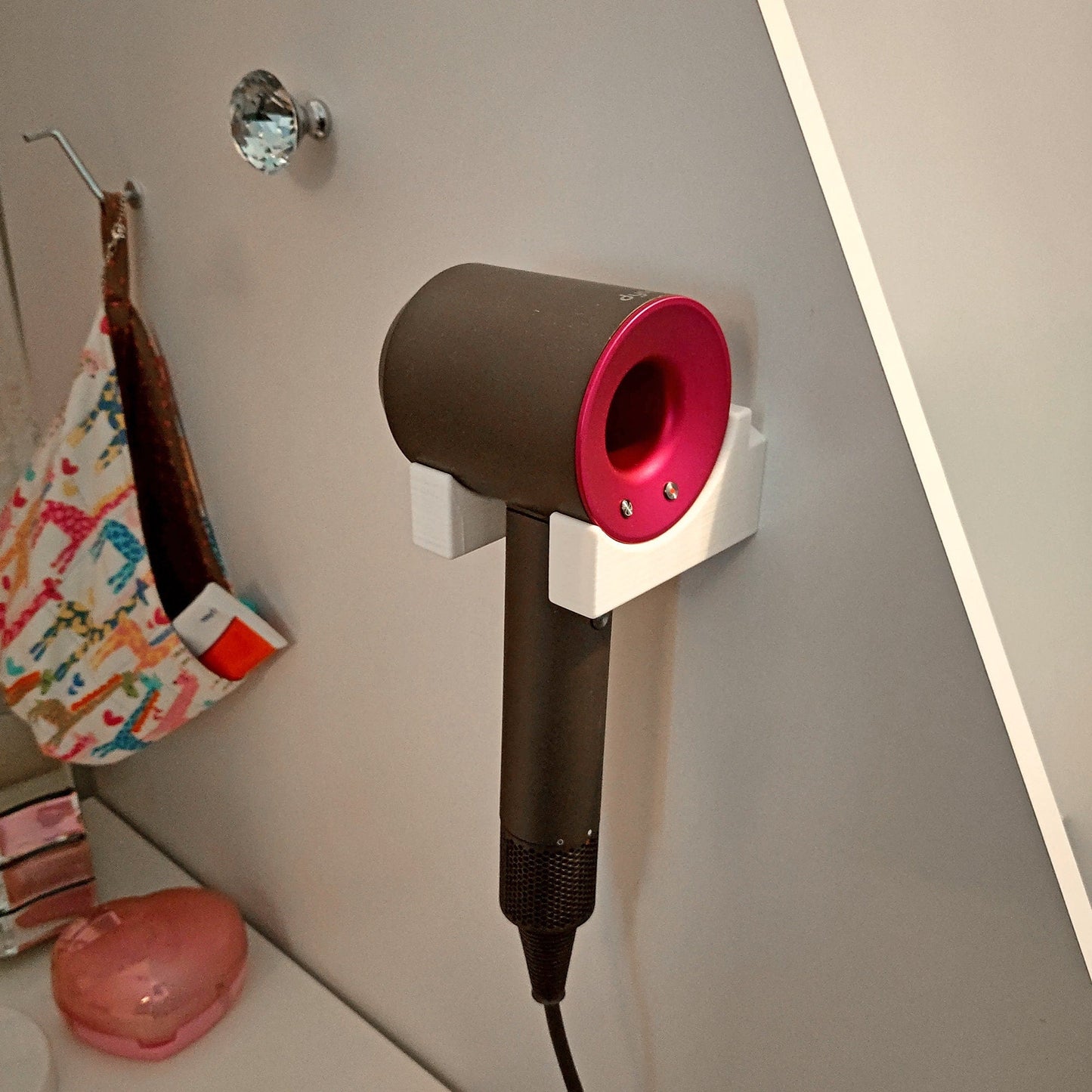 a hair dryer is plugged into a wall