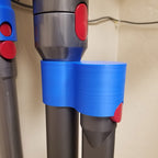 Storage clip holding a Dyson V7 or V8 stick vacuum wand upright on a broom handle